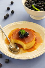 Creme caramel with fresh blueberries.