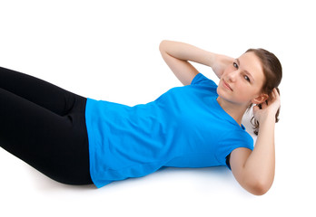 Fototapeta premium young woman doing sit ups