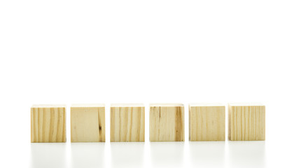 Row of six blank wooden blocks