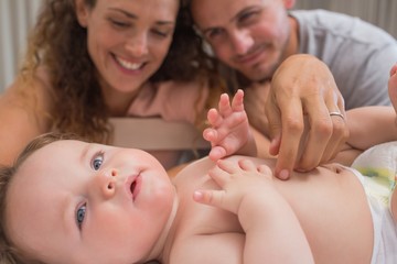 Loving parents looking at baby