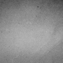 Film Grained Crumpled textured  recycled paper  background. Vin