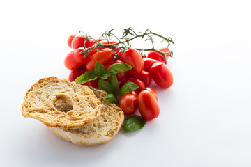 tomatoes and brad isolated on white background