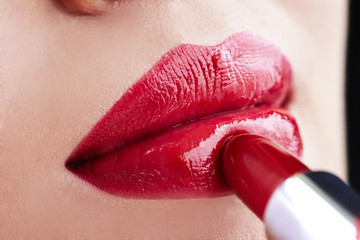 Close-up of a lipstick on a woman's lips