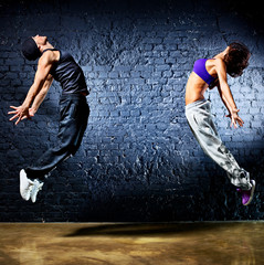 Young dancer couple jumping