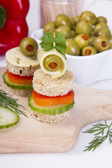 finger foods: bread, peppers, cucumber, cheese and olives