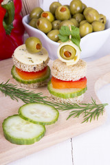 finger foods: bread, peppers, cucumber, cheese and olives