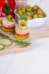 finger foods: bread, peppers, cucumber, cheese and olives