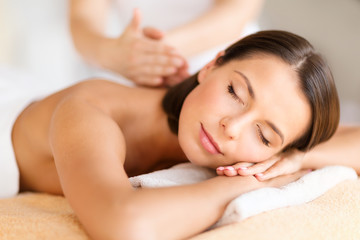 beautiful woman in spa salon getting massage