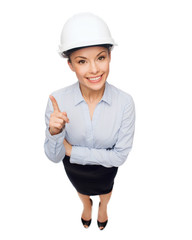 businesswoman in white helmet with finger up