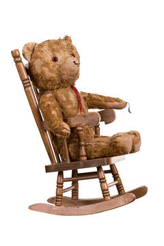 Old Teddybear On Wooden Chair