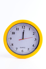 Yellow clock alarm isolated on white background