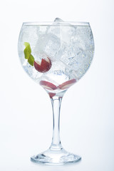 grape and lime gin tonic isolated over white