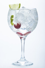 grape and lime gin tonic isolated over white