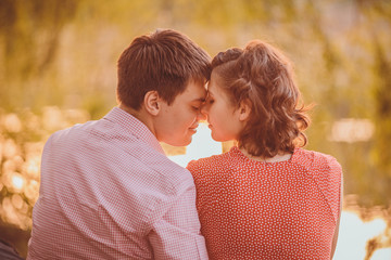 Portrait of young couple in flowering park