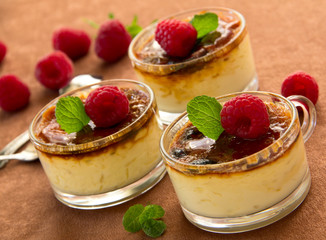 Creme brulee  with raspberries and mint.