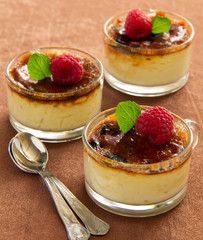 Creme brulee  with raspberries and mint.