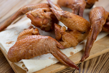 Close-up of smoked chicken wings, horizontal shot