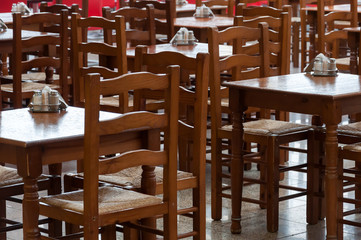 Wooden tables and chairs in a cafe