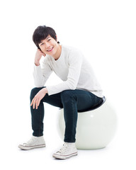 Young Asian person sitting on the chair.
