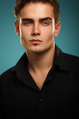 Obraz premium Trendy young man in black shirt, portrait of sexy fashion boy lo