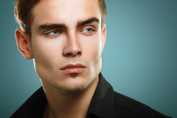 Trendy young man in black shirt, portrait of sexy fashion boy lo