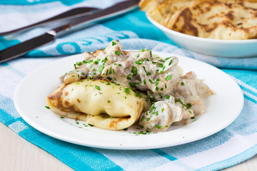 Russian pancakes with chicken, mushrooms champignon, Shrovetide