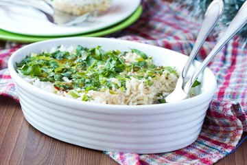 Rice casserole with egg, green spring onions, cilantro, chili