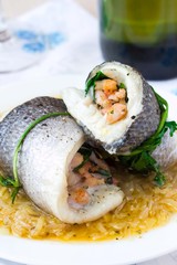 Fish rolls of dorado fillet stuffed shrimp and spinach, onion