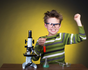 Young boy performing experiments. Little scientist.