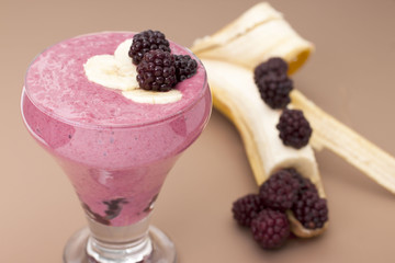 Сocktail of  banana with frozen  blackberries and  yogurt.