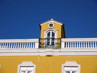 Rooftop window on typical Portuguese building