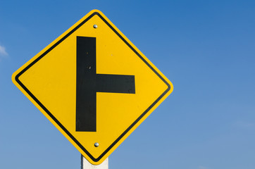 Crossroads sign on blue sky