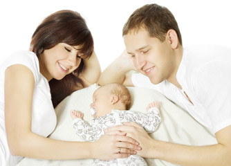 Fototapeta na wymiar Happy family embracing sleeping newborn baby