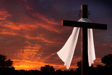 Dramatic Lighting on Christian Easter Cross at Sunrise - 60391289