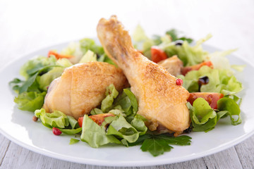 chicken leg and salad