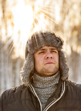 man in a fur winter hat