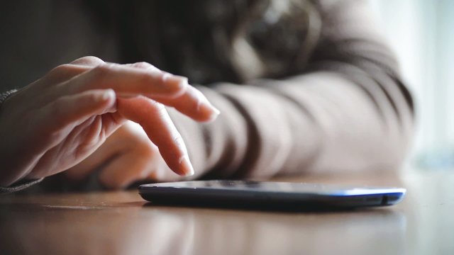 close up of hands woman using typing on smart phone cellphone 