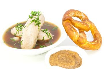 sausages in beer sauce with mustard and pastries