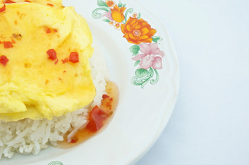 Triangle omelette on rice with  chill sauce