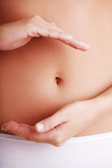 Fit and slim young woman belly