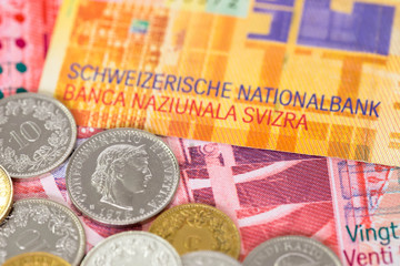 Switzerland money swiss franc banknote and coins close-up (focus