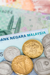 Malaysian money ringgit banknote and coins close-up (focus on co