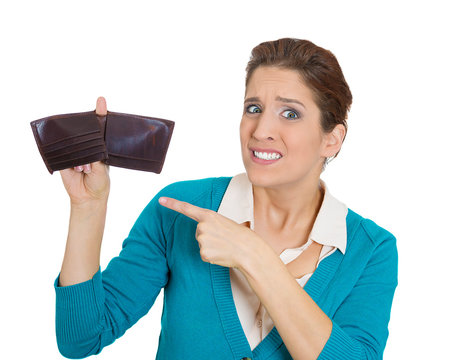 Shocked woman showing empty wallet