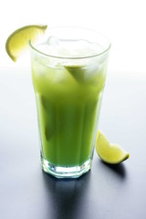 Green cocktail with lime, isolated on white background