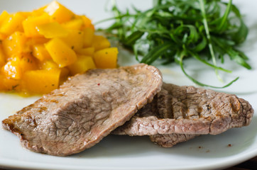 Grilled meat with pumpkin and ruccola