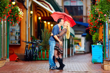 happy couple having fun on colorful street