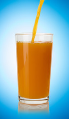 Pouring orange juice  into glass