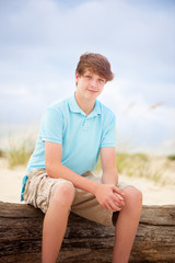 teen boy smiling on the beach