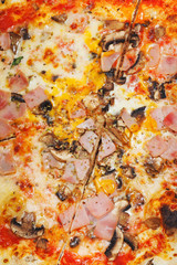 Obraz na płótnie Canvas italian pizza with fungi and ham