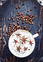 Cup of aromatic coffee and coffee beanes/coffee background